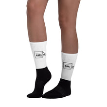 Load image into Gallery viewer, K.O.  Basic logo socks with black cushioned bottom and white ribbed leg portion. Crew length.
